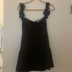Lovers + Friends black off shoulder mini dress with mesh cutouts in size 2.